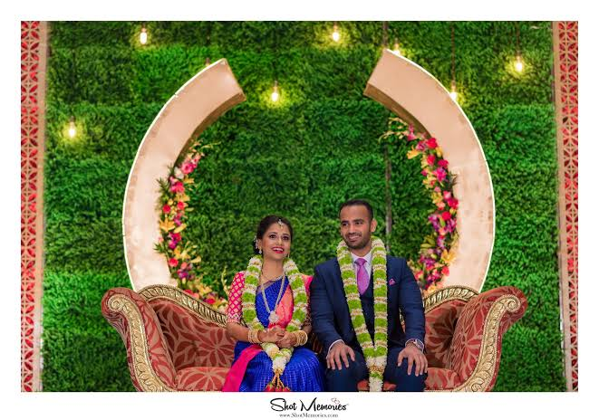 Couple Portrait on Royal Couch with Backdrop